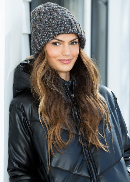 Adeline Beanie Black - Close-up of the cable knit texture, showcasing its warmth and classic style.

